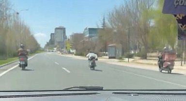 Canını hiçe sayıp motosikleti üzerine uzanarak sürdü